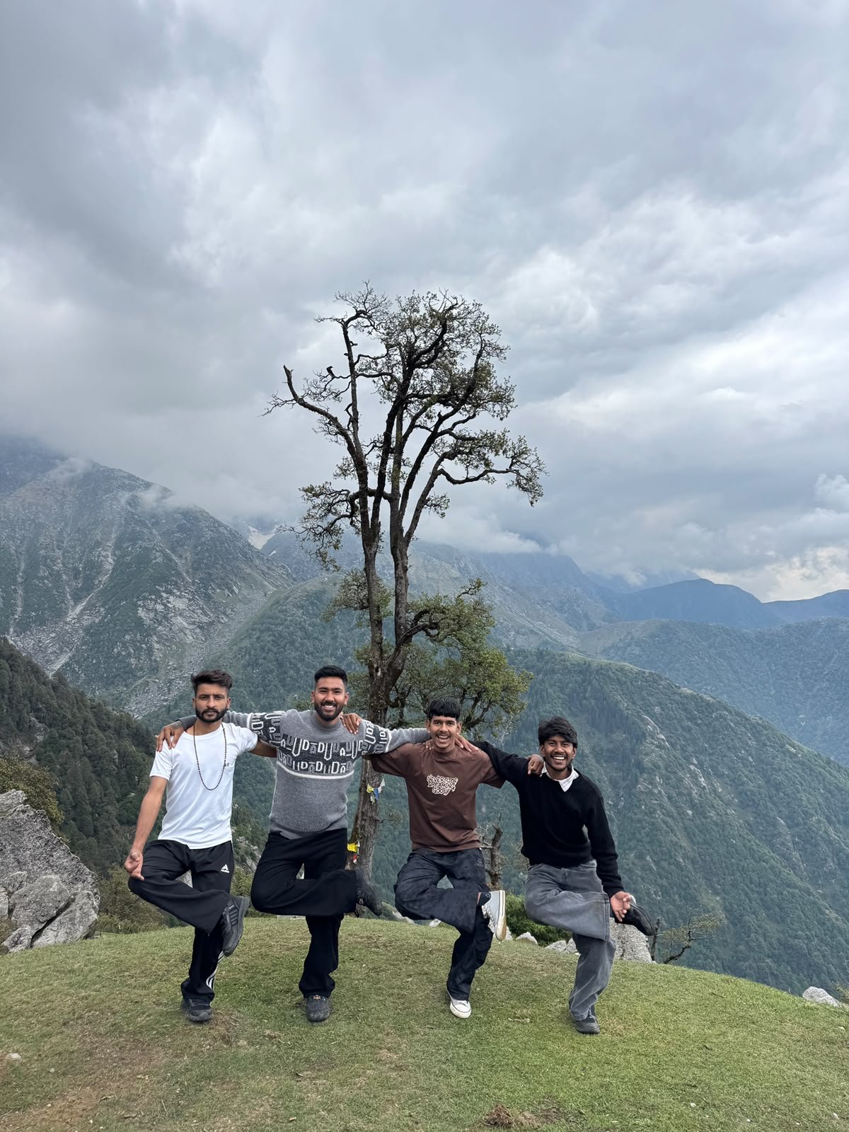 Summit pose — the crew on top of the meadow